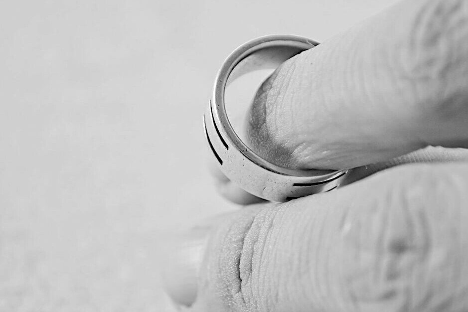 Close up of a hand with a wedding ring